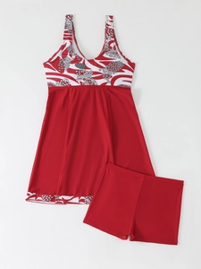 Detail of red floral skirted tankini with matching boyleg bottoms and abstract patterns
