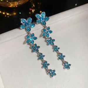 Elegant long flower tassel earrings with blue zircons and silver finish for women