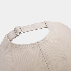 Macro detail of high-density twill cotton baseball cap with adjustable metal buckle