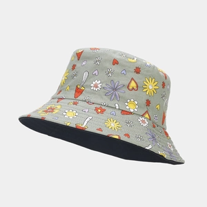 Close-up of reversible bucket hat featuring vibrant flower and mushroom graffiti patterns