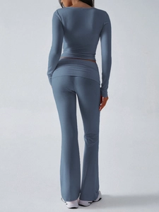 Rear view of blue slim-fit knit two-piece set featuring long sleeves and flared trousers