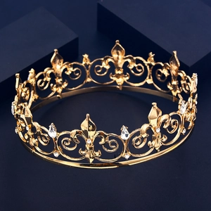 Detailed view of a golden crown featuring fleur-de-lis motifs and clear gemstones