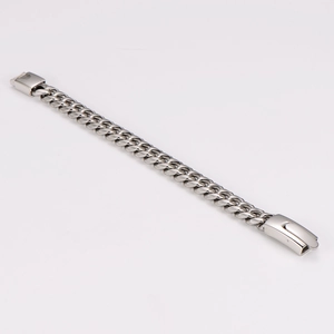 Detailed close-up of a polished silver Cuban link chain bracelet with a secure clasp lock