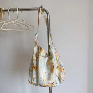 Close-up of minimalist cotton tote bag with abstract ink wash marble pattern print