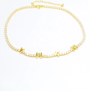 Detail of gold MAMA letter pendant with white zircon stones and adjustable lobster clasp chain