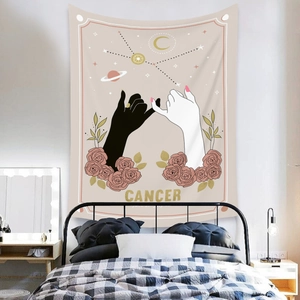Detail of Cancer zodiac tapestry with pink roses and minimalist line art on bedroom wall