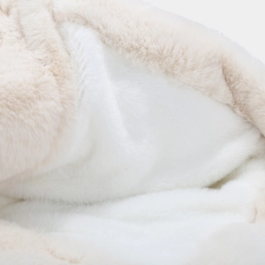 Close-up of soft fluffy faux rabbit fur lining on a thermal thick ear protection hat