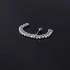 Macro view of silver stainless steel curved earring with white pearl and screw ball closure