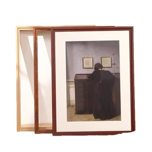 Classic wooden picture frames in various wood tones with white mat and vintage oil painting