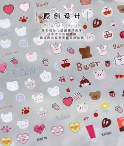 Detailed view of cute cartoon bear and bunny adhesive nail art stickers KX079 and KX080
