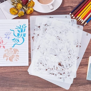 Set of 4 translucent PET painting stencils with floral and butterfly patterns on wood
