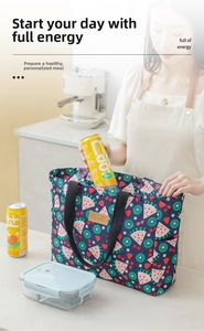 Detail of waterproof insulated cooler bag with fruit patterns and side storage pocket