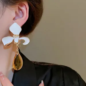 Elegant gold-edged white flower earrings with amber teardrop charms for women