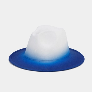 Macro detail of white and blue gradient wool felt fedora with a wide brim and ombre effect