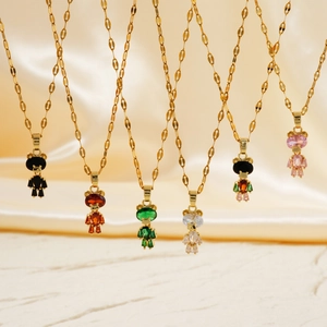 Detailed close-up of six gold bear pendant necklaces with colorful zircon stones