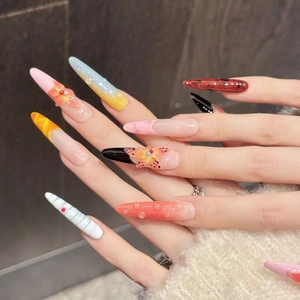 Detailed view of 3D floral stiletto press-on nails with embossed water droplet texture