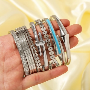 Elegant 7-piece silver stainless steel stacking bracelet set with diverse geometric patterns