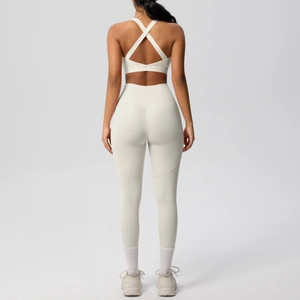 Back view of ivory yoga set featuring crisscross sports bra and high waisted leggings