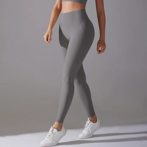 Close-up of grey high-waisted yoga leggings showing seamless high-stretch fabric texture