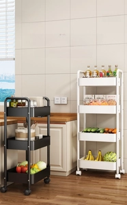 Detail of multi-tier rolling cart with hollow baskets and wheels for kitchen storage