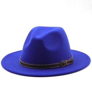 Detail of royal blue wool fedora with a brown leather strap and metal buckle