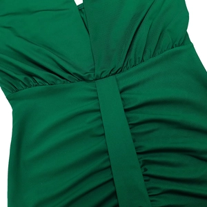 Detailed close-up of the deep V-neck and ruched waist design on this green slim fit dress