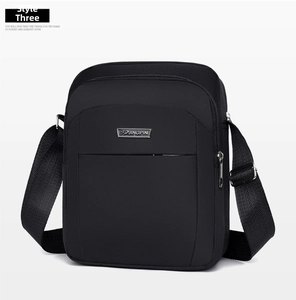 Detail view of JINGPIN logo and durable waterproof nylon fabric on black crossbody bag