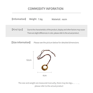 Detail showing dimensions of vintage resin round pendant necklace with 92cm brown cord