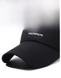 Close-up of black cotton baseball cap brim with white embroidery and reinforced stitching