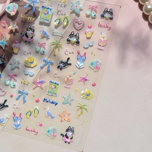 Macro detail of 3D embossed nail stickers featuring summer cats and shell luster finish