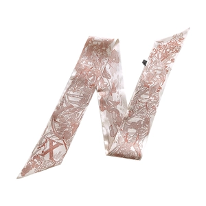 Detail of vintage Toile de Jouy silk twilly scarf with red prints and letter X