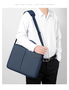 Detail of navy blue laptop bag fabric texture and adjustable shoulder strap
