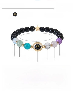 Detail view of 8mm natural stone beads and Libra charm with product size specifications