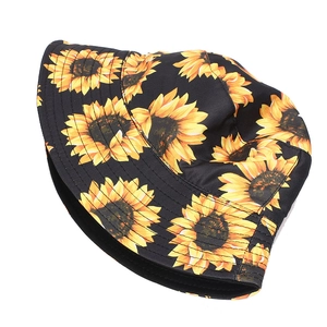 Detailed close-up of sunflower print on black baseball cap with vibrant yellow floral patterns