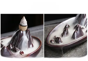 Close-up of ceramic mountain backflow incense burner showing smoky waterfall detail
