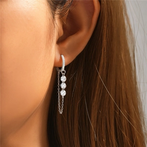Close-up of S925 sterling silver drop earrings with dainty chains and zircon stones