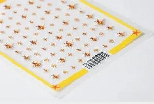 Detailed macro view of TS-058 5D nail art stickers with bee and floral embroidery textures