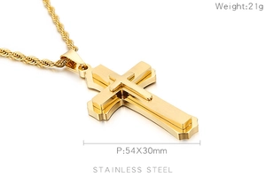 Detail of gold stainless steel cross pendant with brushed finish and 54x30mm size