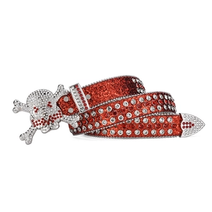 Detailed close-up of a red sequin belt featuring a skull buckle with inlaid rhinestones
