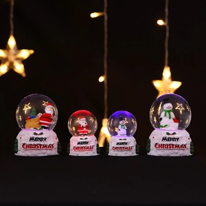Luminous Christmas snow globes with Santa Claus and Snowman on a lighted base