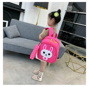 Pink toddler backpack featuring cartoon rabbit print and matching pencil case detail