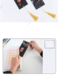 Detail of Chinese style scratch art bookmark with gold tassel and mountain scenery patterns