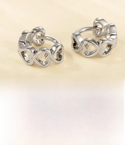 Detail view of silver hollow heart hoop earrings made of copper with 6mm inner diameter