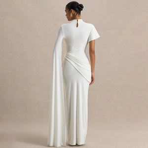 Elegant white one-shoulder maxi dress with cape sleeve and draped pleated detail