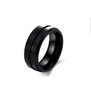 Detail of matte black titanium steel ring for men with center groove and beveled edges