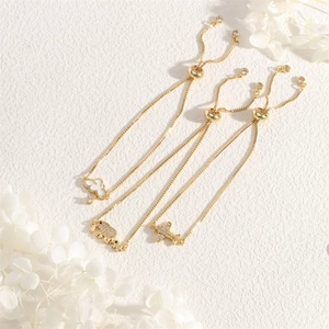 Three-piece gold bolo bracelets featuring cloud, elephant, and airplane pendants with zircons