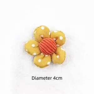 Detail view of 4cm yellow polka dot fabric flower accessory for DIY hair accessories