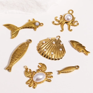 Detailed set of 7 gold-toned ocean-themed DIY pendants including octopus and crab charms