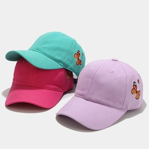 Detail of butterfly embroidery on mint, pink and purple cotton baseball caps
