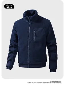 Detail of navy blue fleece jacket showing stand collar, zipper pocket and reinforced sleeves